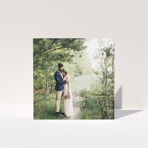 Wedding Thank You Card Design - "Simple Square Thanks" A wedding thank you card design named "Simple Square Thanks". It is a square (148mm x 148mm) card in a square orientation. It is a photographic wedding thank you card with room for 1 photo. "Simple Square Thanks" is available as a folded card, with mainly black colouring.