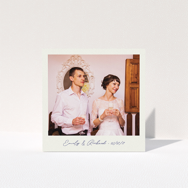 A wedding thank you card called "Snapshot". It is a square (148mm x 148mm) card in a square orientation. It is a photographic wedding thank you card with room for 1 photo. "Snapshot" is available as a folded card, with tones of white and Navy blue.