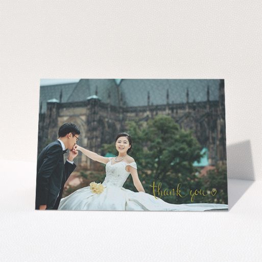 Wedding Thank You Card Design - "Thank you with a heart" A wedding thank you card design titled "Thank you with a heart". It is an A5 card in a landscape orientation. It is a photographic wedding thank you card with room for 1 photo. "Thank you with a heart" is available as a folded card, with mainly gold colouring.