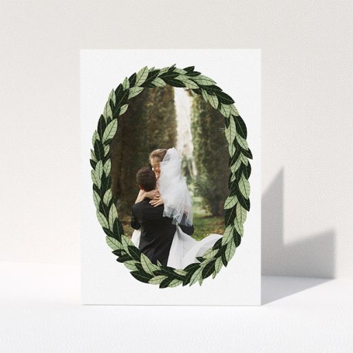 Wedding Thank You Card Design - "Thick Wreath Frame" A wedding thank you card design titled "Thick Wreath Frame". It is an A5 card in a portrait orientation. It is a photographic wedding thank you card with room for 1 photo. "Thick Wreath Frame" is available as a folded card, with tones of light green and dark green.