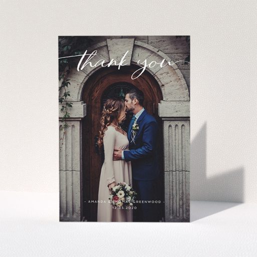 Wedding Thank You Card Design - "Topped and Bottomed" A wedding thank you card called "Topped and Bottomed". It is an A5 card in a portrait orientation. It is a photographic wedding thank you card with room for 1 photo. "Topped and Bottomed" is available as a folded card, with mainly white colouring.