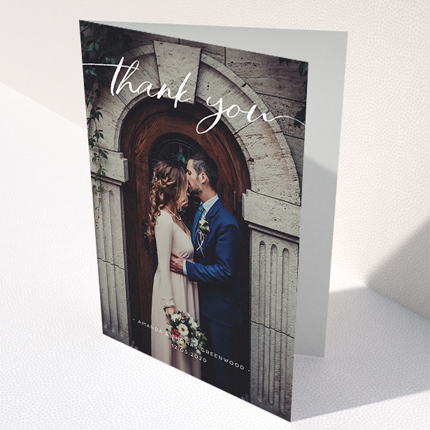 A wedding thank you card called "Topped and Bottomed". It is an A5 card in a portrait orientation. It is a photographic wedding thank you card with room for 1 photo. "Topped and Bottomed" is available as a folded card, with mainly white colouring.