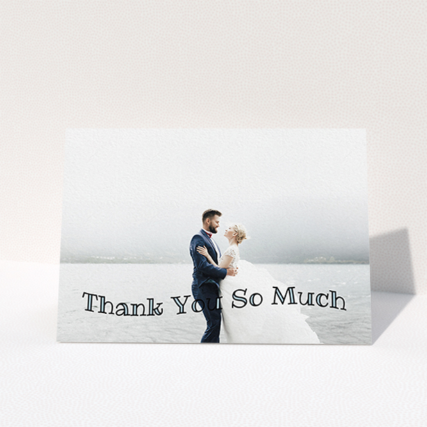 A wedding thank you card design named "Wave of Thanks". It is an A6 card in a landscape orientation. It is a photographic wedding thank you card with room for 1 photo. "Wave of Thanks" is available as a folded card, with mainly blue colouring.