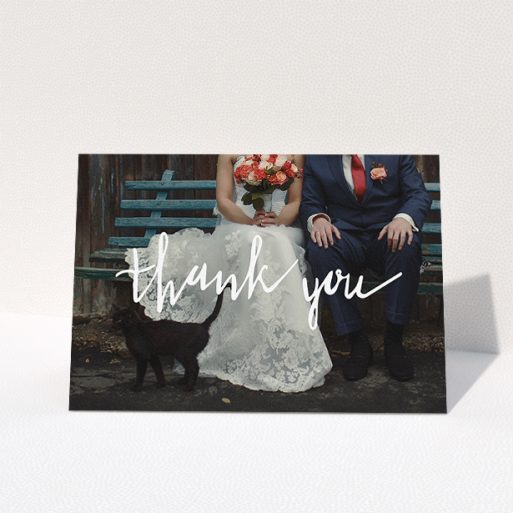 Wedding Thank You Card Design - "Wonky thank you" A wedding thank you card template titled "Wonky thank you". It is an A5 card in a landscape orientation. It is a photographic wedding thank you card with room for 1 photo. "Wonky thank you" is available as a folded card, with mainly white colouring.