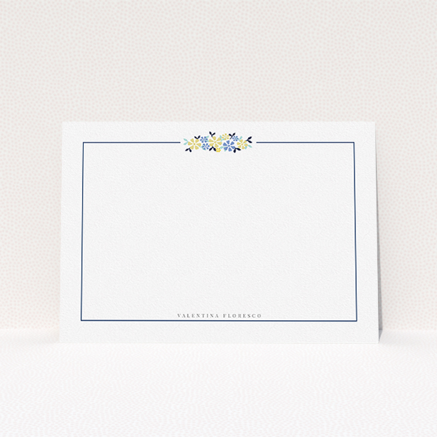 A womens correspondence card design named "Surrounded by flowers". It is an A5 card in a landscape orientation. "Surrounded by flowers" is available as a flat card, with tones of white and blue.